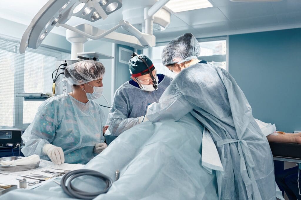 A team of women and men surgeons doing complex heart surgery, cardiovascular surgery, modern